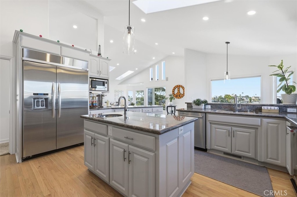 8325 Delgany Avenue Playa del Rey, CA 90293 - Photo 4 of 50 a kitchen with stainless steel appliances granite countertop a sink a refrigerator and a oven