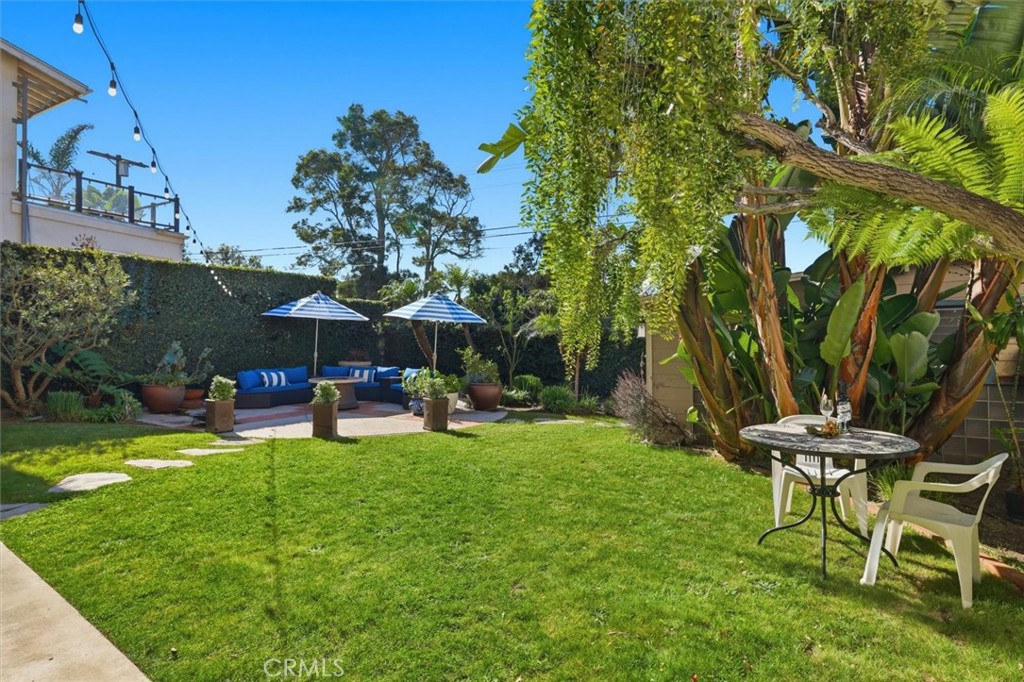 8325 Delgany Avenue Playa del Rey, CA 90293 - Photo 5 of 50 a view of a chairs and table in backyard of the house