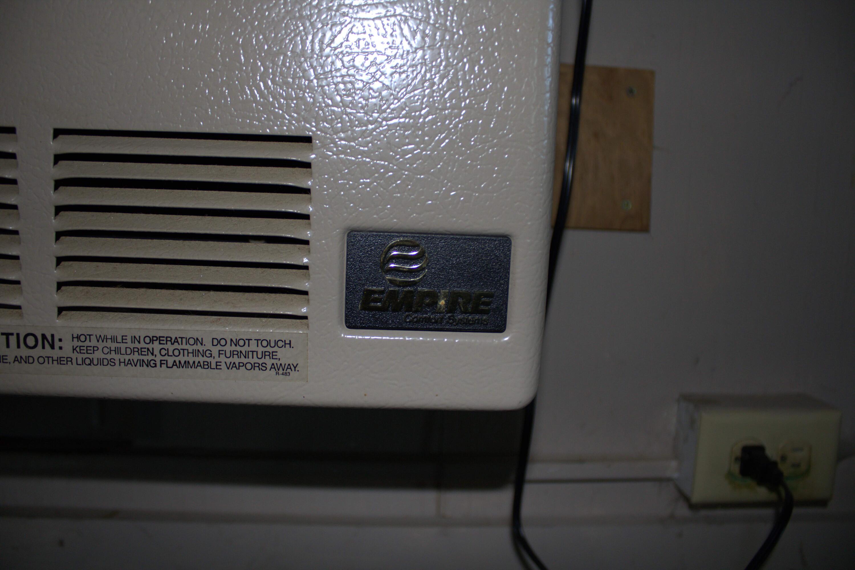 83 Rogers Road Troy, ME 04987 - Photo 37 of 45 empire wall heater in living area