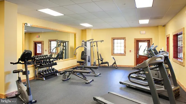 a dining table with chairs and window