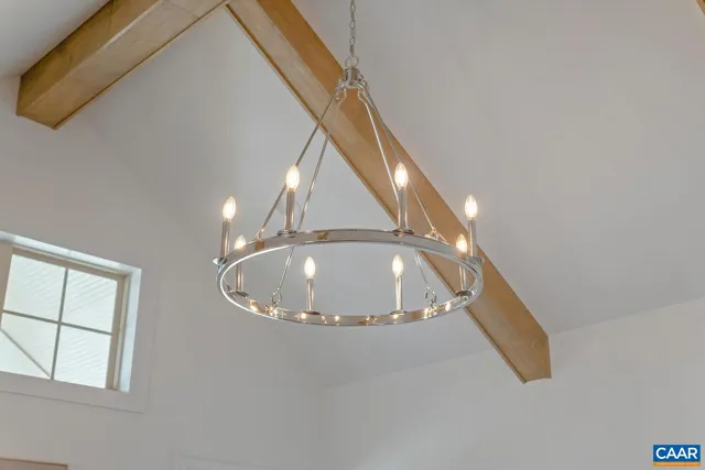 a workspace with white cabinets and wooden floor