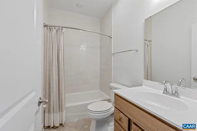 a utility room with sink dryer and washer