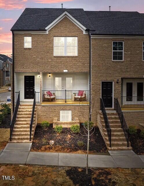 a front view of a house with stairs
