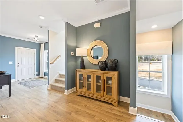 a view of a living room a window and wooden floor