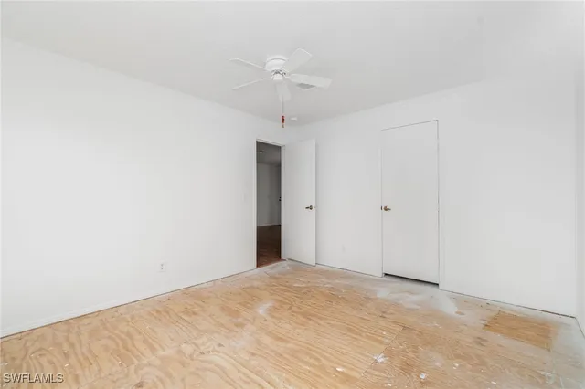 a view of a room with a ceiling fan