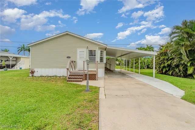a view of a backyard with a garden and plants