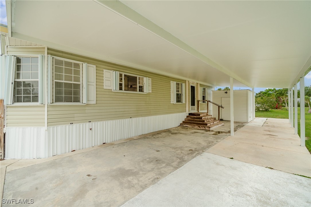 7679 Farrell Road Bokeelia, FL 33922 - Photo 5 of 34 front view of a house
