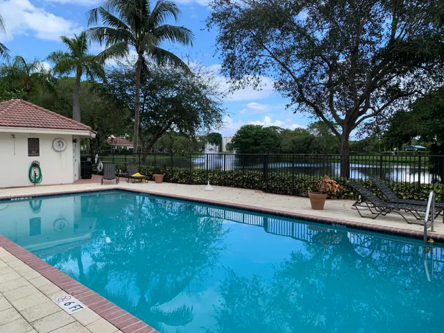 a view of a swimming pool with a patio