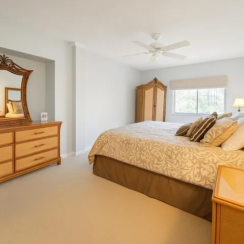 a bedroom with a bed and a dresser