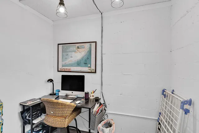 a workspace with furniture and window