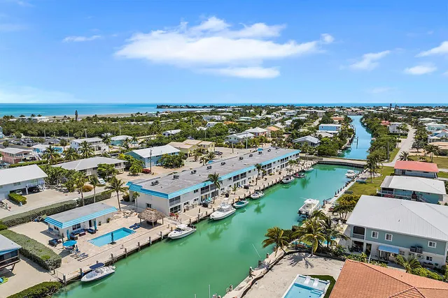 an aerial view of residential houses with outdoor space