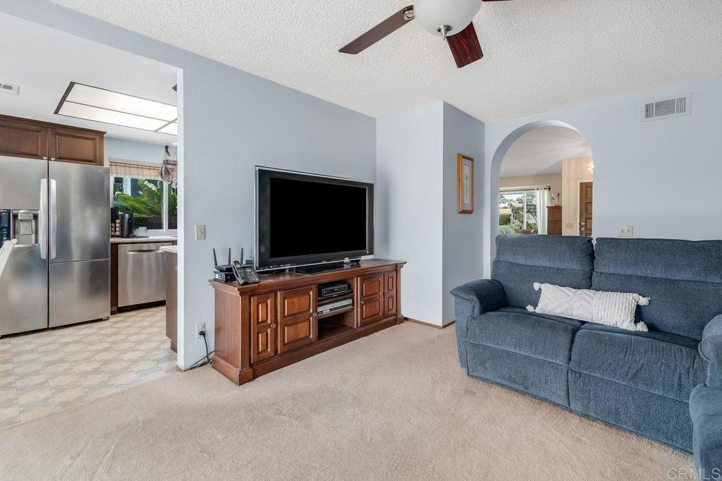 1064 Glen Arbor Drive Encinitas, CA 92024 - Photo 14 of 39 a living room with furniture and a flat screen tv