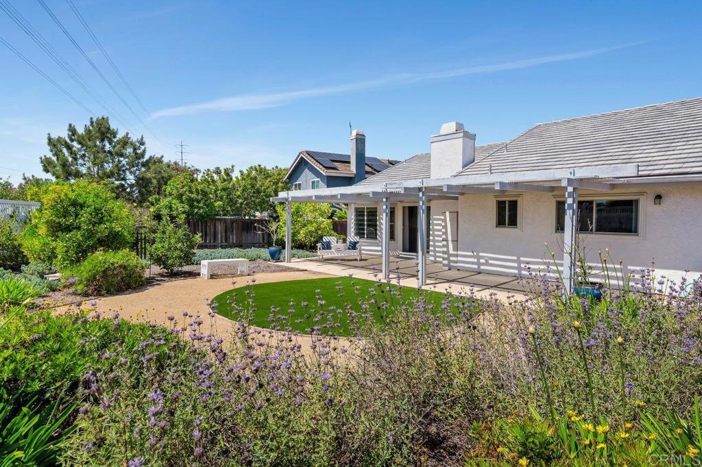1064 Glen Arbor Drive Encinitas, CA 92024 - Photo 19 of 39 a front view of a house with garden