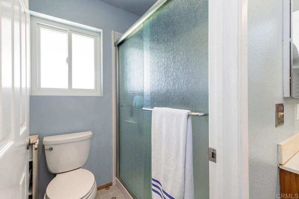 1064 Glen Arbor Drive Encinitas, CA 92024 - Photo 25 of 39 a white toilet sitting next to a bathroom sink