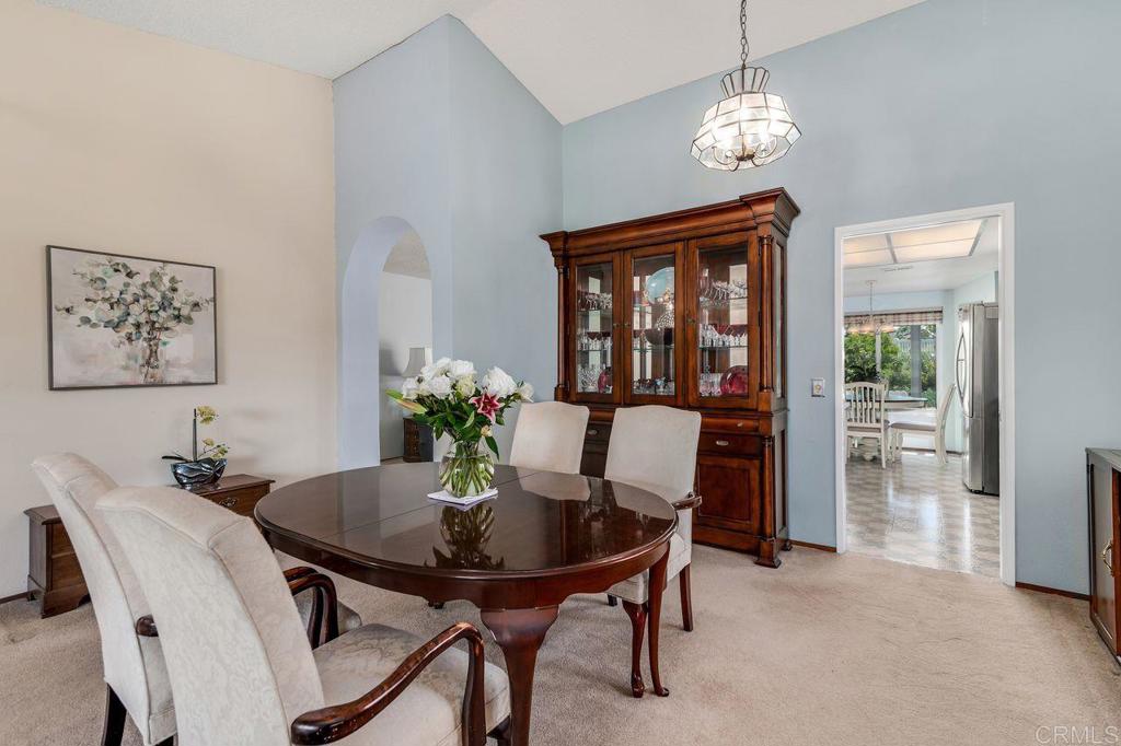 1064 Glen Arbor Drive Encinitas, CA 92024 - Photo 6 of 39 a view of a dining room with furniture window and wooden floor