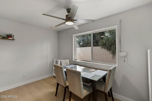 a view of a dining room with furniture and window