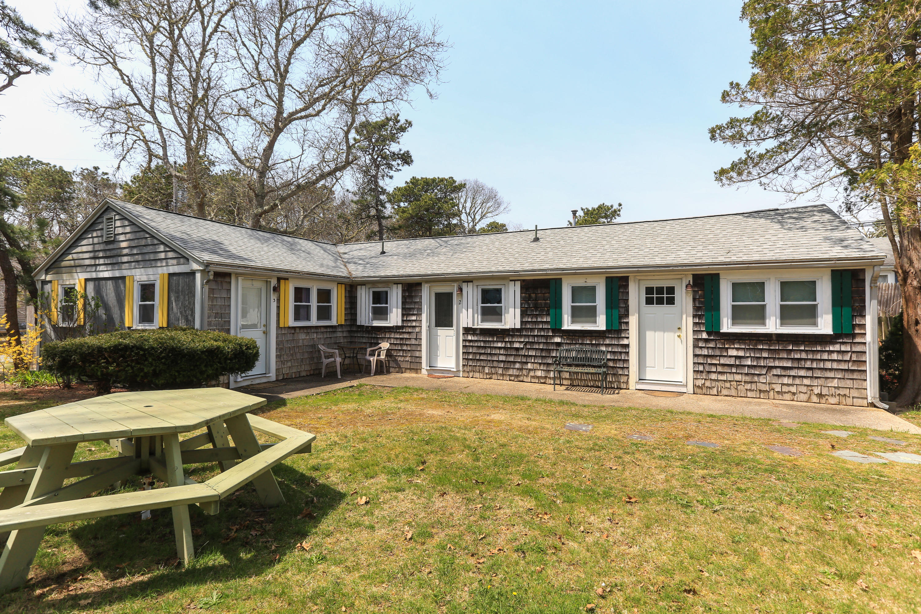 71 Shad Hole Road, Unit U2 Dennis Port, MA 02639 - Photo 3 of 14 a view of a house with a yard