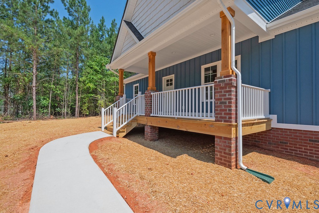 2223 Ridge Road Arvonia, VA 23004 - Photo 6 of 45 Board and batten siding with a brick foundation, f