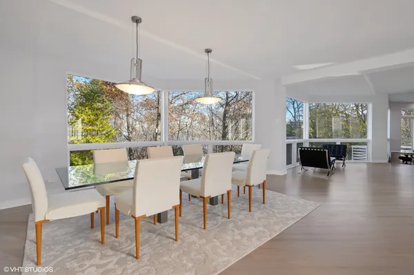 a dining room with furniture window wooden floor