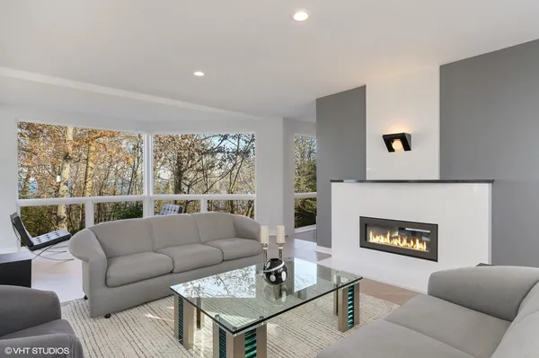 a living room with furniture and a large window