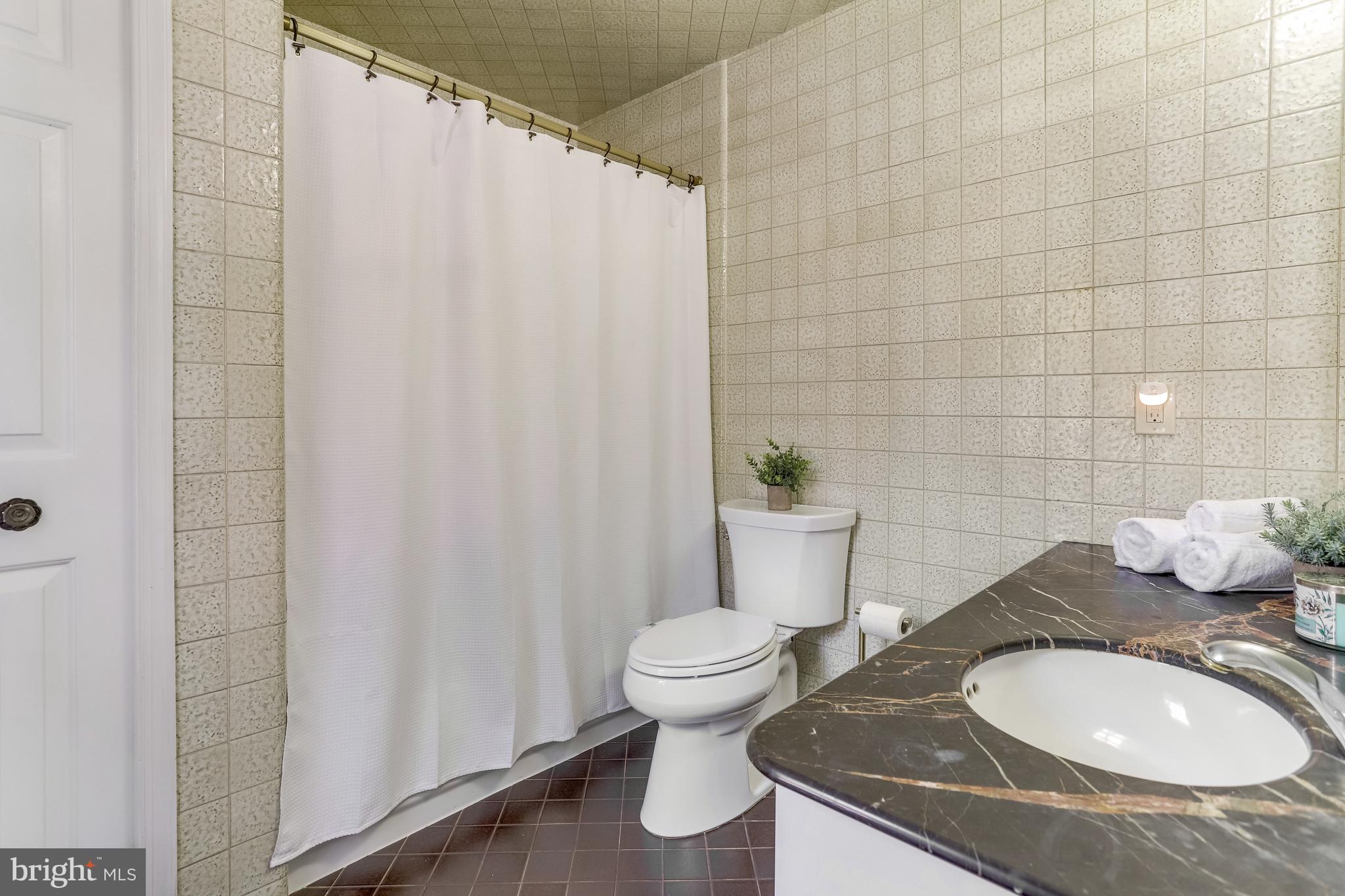 9210 Rockefeller Lane Springfield, VA 22153 - Photo 32 of 44 Full primary bathroom with a tub and shower combo