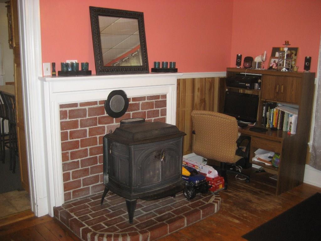 453 Old County Road Rockland, ME 04841 - Photo 16 of 32 Dining room with wood stove, brick...