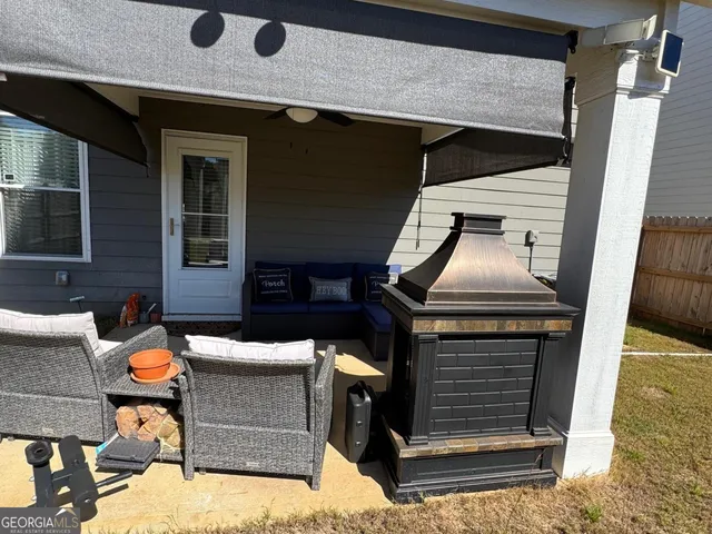 a front view of a house with outdoor seating