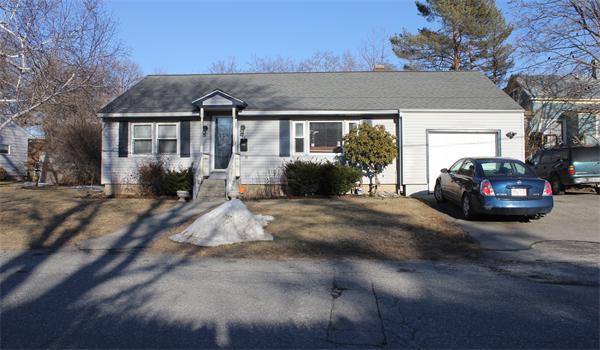 29 Cogger Road Lowell, MA 01854 - Photo 1 of 24 a front view of a house with yard and parking space