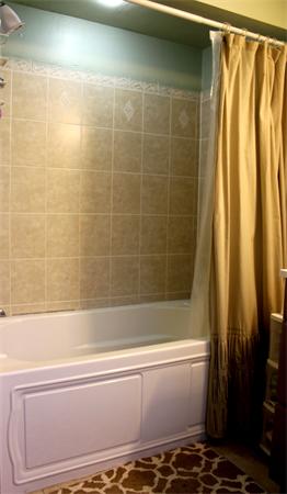 29 Cogger Road Lowell, MA 01854 - Photo 15 of 24 a bathroom with a bathtub and shower