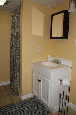 29 Cogger Road Lowell, MA 01854 - Photo 16 of 24 a bathroom with a sink and a mirror