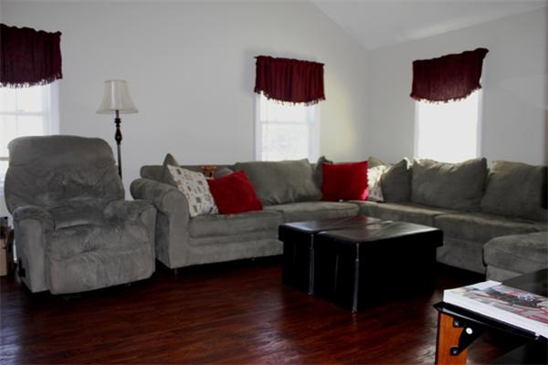 29 Cogger Road Lowell, MA 01854 - Photo 17 of 24 a living room with furniture and a flat screen tv