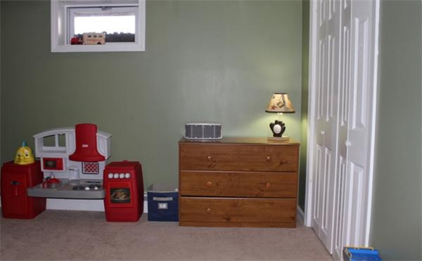 29 Cogger Road Lowell, MA 01854 - Photo 20 of 24 a room with a dresser and a window