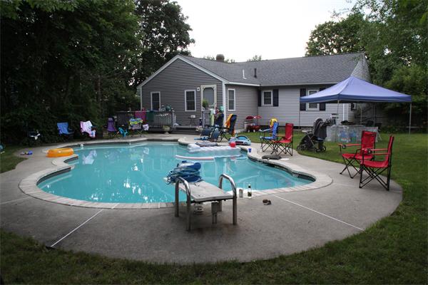 29 Cogger Road Lowell, MA 01854 - Photo 24 of 24 a view of a house with backyard swimming pool and sitting area
