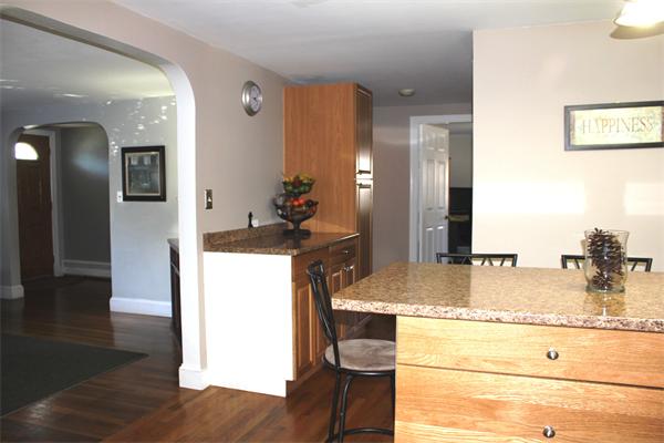 29 Cogger Road Lowell, MA 01854 - Photo 4 of 24 a bathroom with a granite countertop sink and a mirror