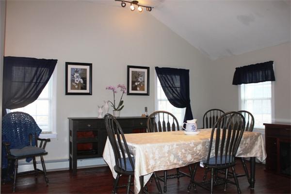 29 Cogger Road Lowell, MA 01854 - Photo 5 of 24 a view of a dining room with furniture and wooden floor
