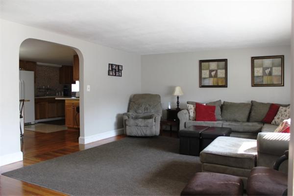 29 Cogger Road Lowell, MA 01854 - Photo 7 of 24 a living room with furniture and a wooden floor