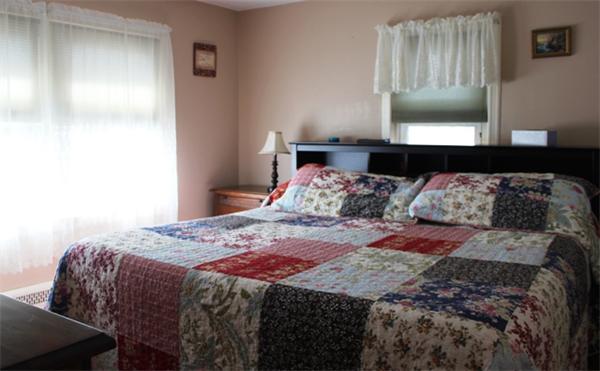 29 Cogger Road Lowell, MA 01854 - Photo 8 of 24 a bedroom with a bed and dresser