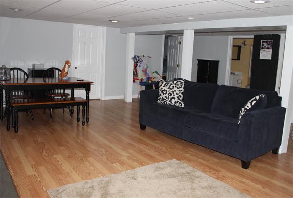 29 Cogger Road Lowell, MA 01854 - Photo 10 of 24 a living room with furniture and wooden floor