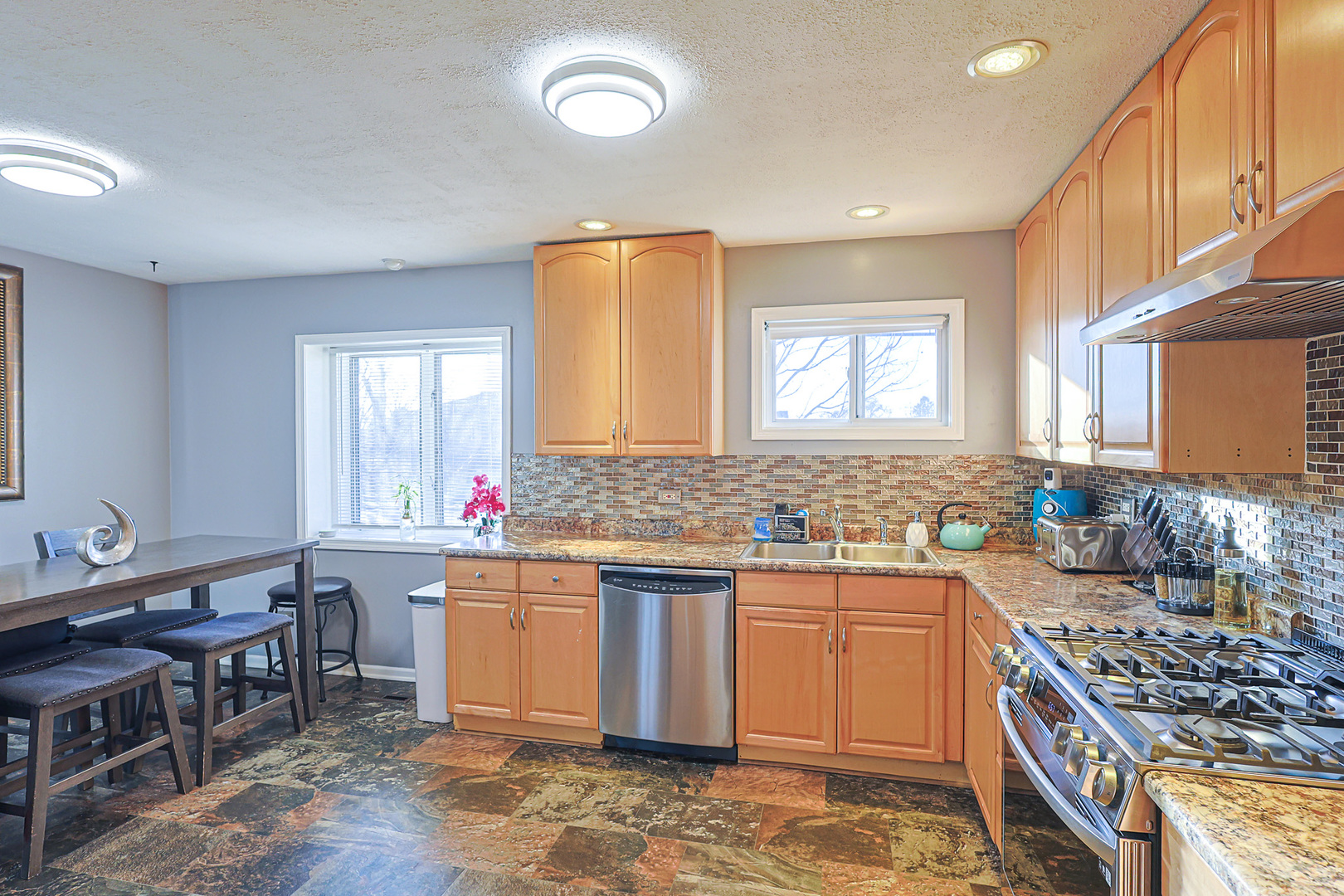1501 Pawnee Road Carpentersville, IL 60110 - Photo 15 of 22 a kitchen with a sink stove and cabinets