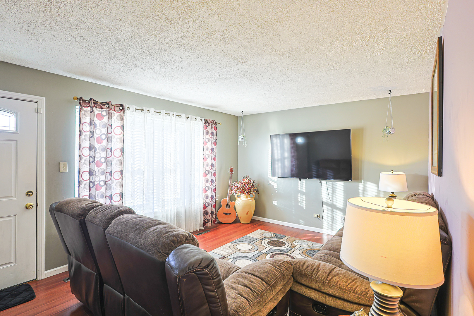 1501 Pawnee Road Carpentersville, IL 60110 - Photo 16 of 22 a bedroom with a bed and a flat screen tv