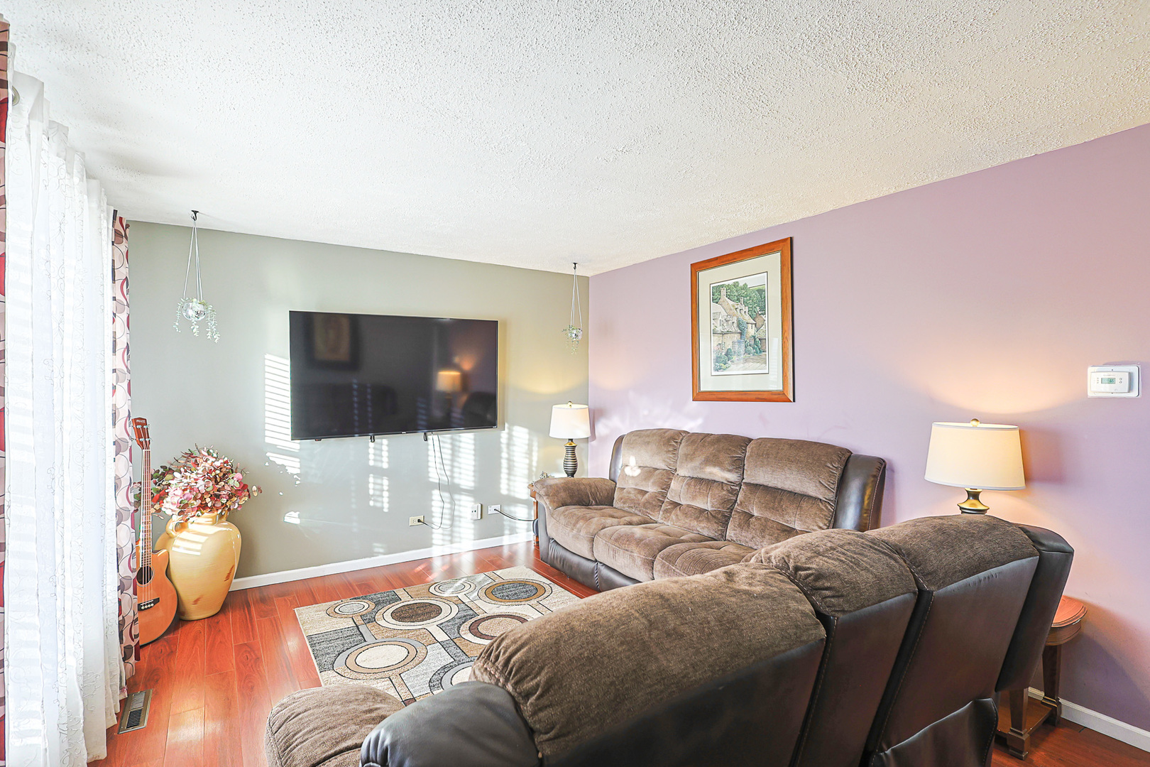1501 Pawnee Road Carpentersville, IL 60110 - Photo 17 of 22 a living room with furniture and a flat screen tv