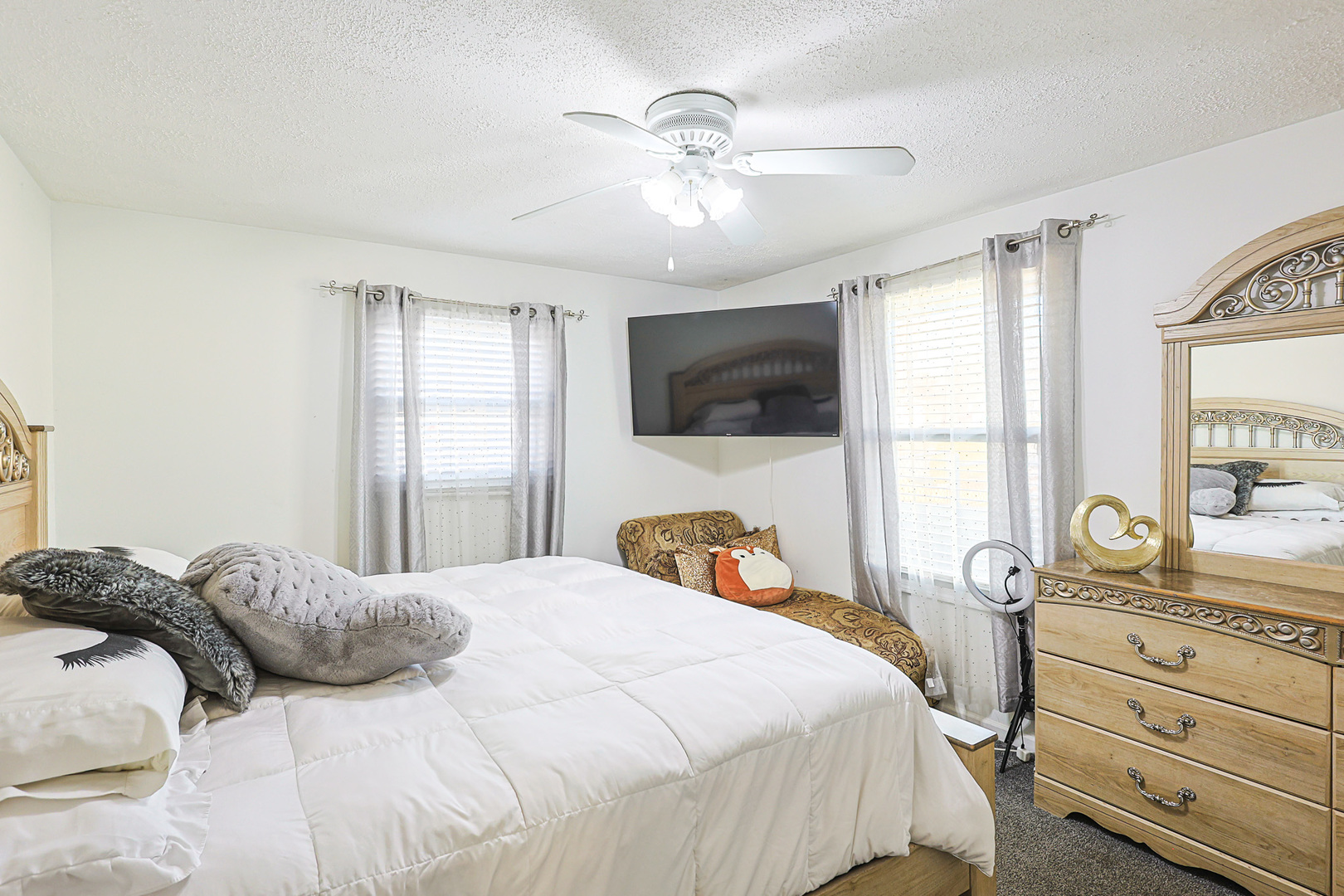 1501 Pawnee Road Carpentersville, IL 60110 - Photo 19 of 22 a bedroom with a bed and a large window with the dresser