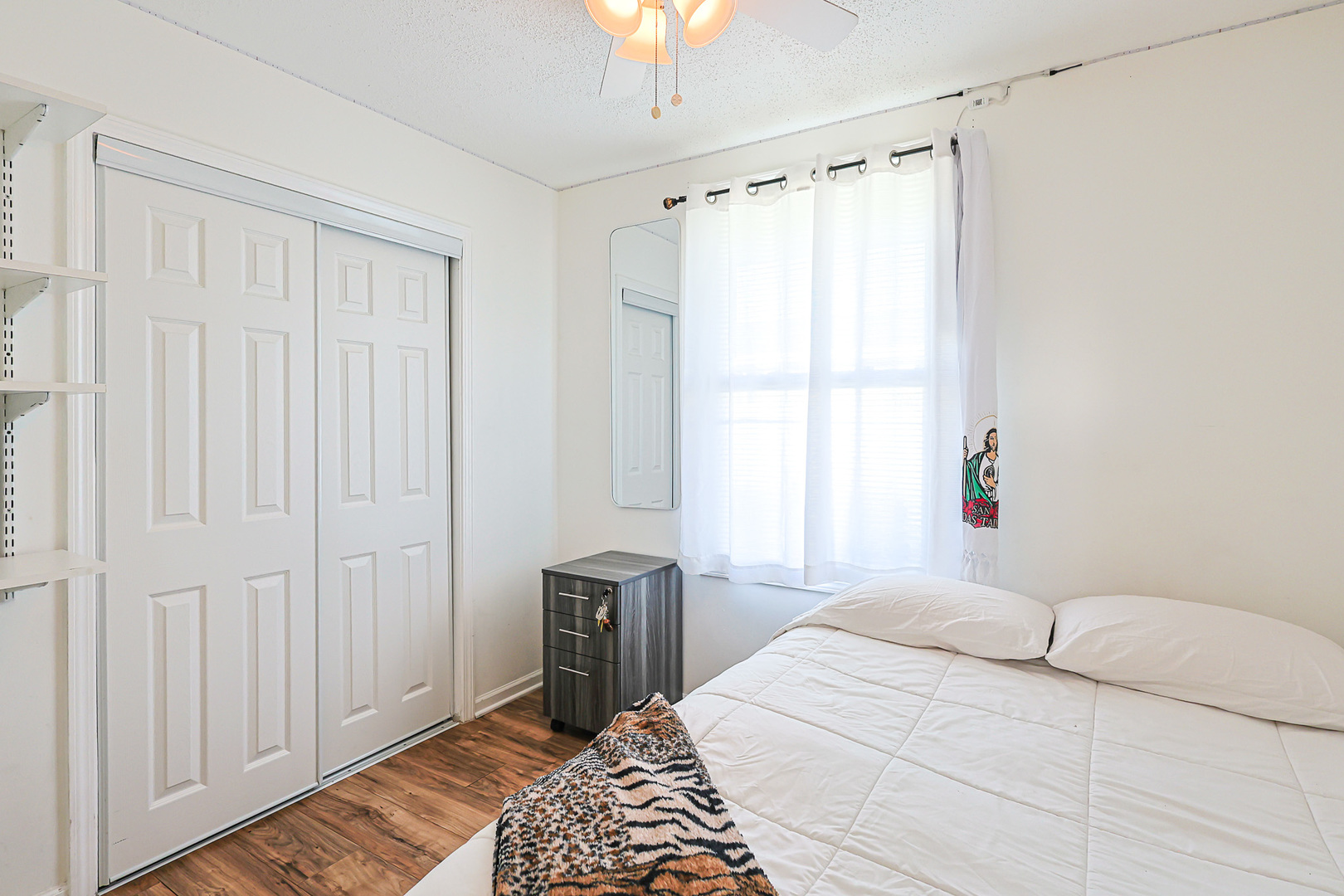 1501 Pawnee Road Carpentersville, IL 60110 - Photo 21 of 22 a bedroom with a bed and a window