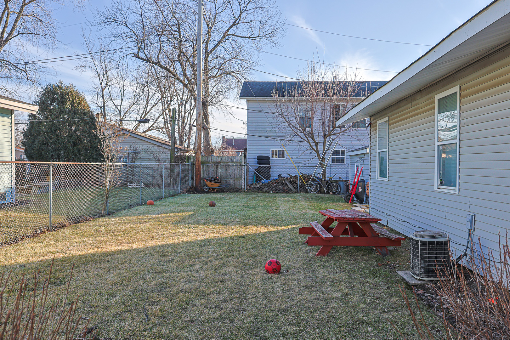 1501 Pawnee Road Carpentersville, IL 60110 - Photo 5 of 22 a view of backyard with wooden fence
