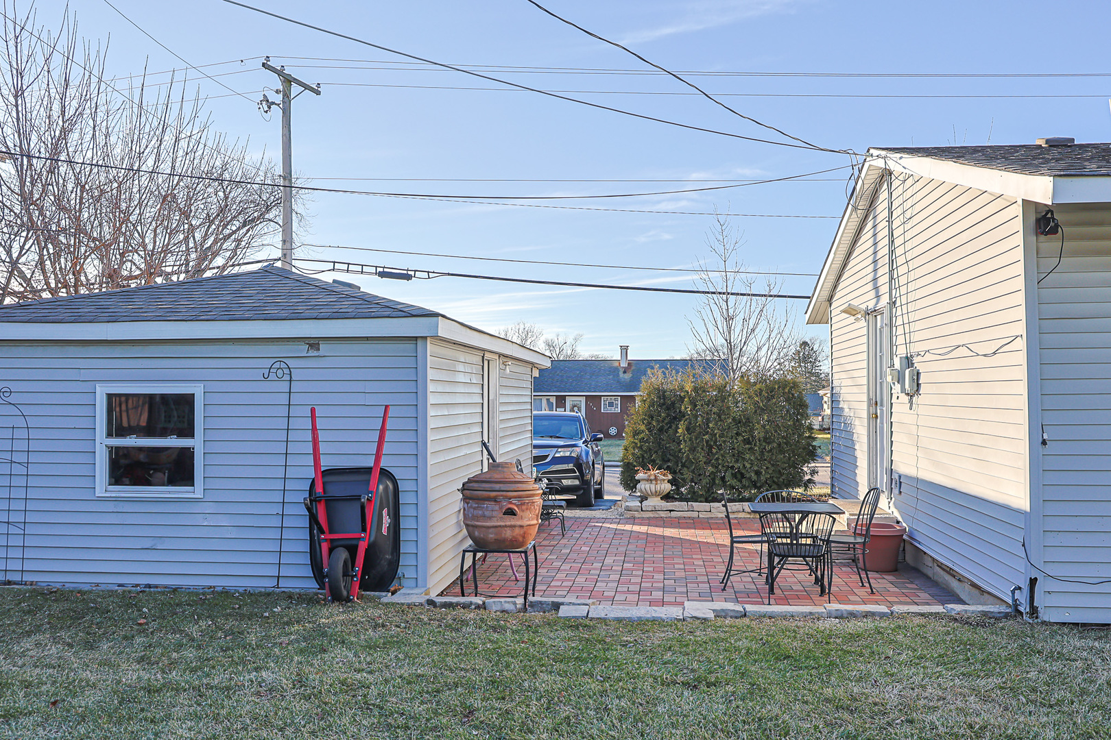 1501 Pawnee Road Carpentersville, IL 60110 - Photo 9 of 22 a view of a backyard with table and chairs and a barbeque