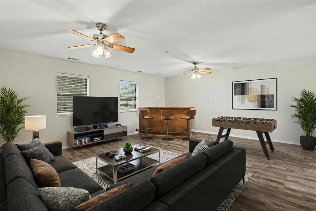 10101 Round Hill Road Fort Worth, TX 76131 - Photo 20 of 30 a living room with furniture and a flat screen tv