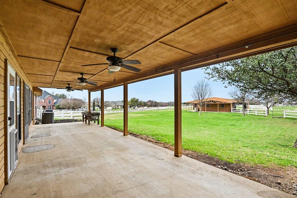 10101 Round Hill Road Fort Worth, TX 76131 - Photo 26 of 30 a view of a house with backyard and porch