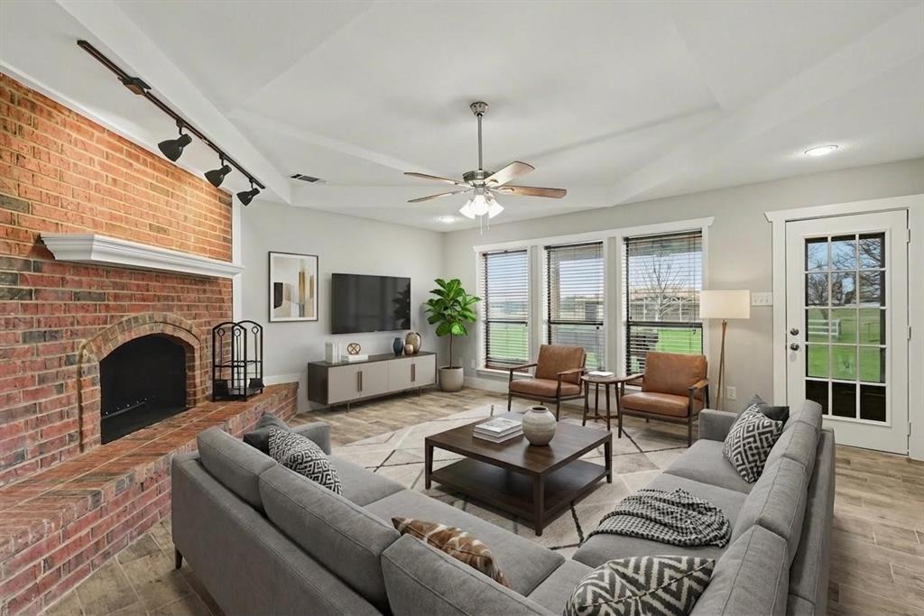 10101 Round Hill Road Fort Worth, TX 76131 - Photo 3 of 30 a living room with furniture fireplace and a large window
