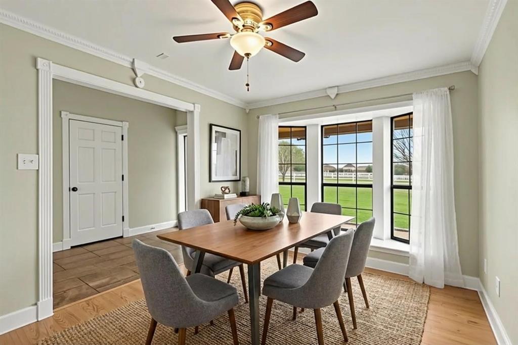 10101 Round Hill Road Fort Worth, TX 76131 - Photo 8 of 30 a view of a dining room with furniture window and wooden floor