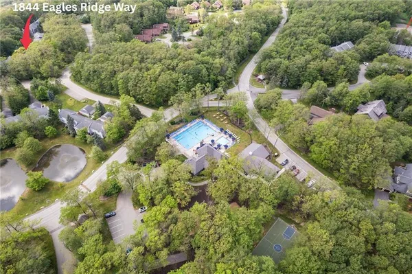 a view of swimming pool with outdoor seating and plants